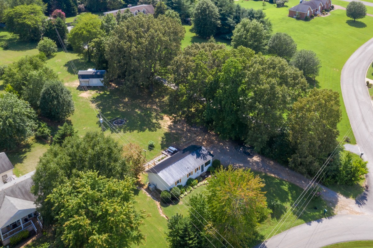 341 Lee Road Cottontown, TN 37048 - Photo 4 of 43 an aerial view of residential house with outdoor space and swimming pool