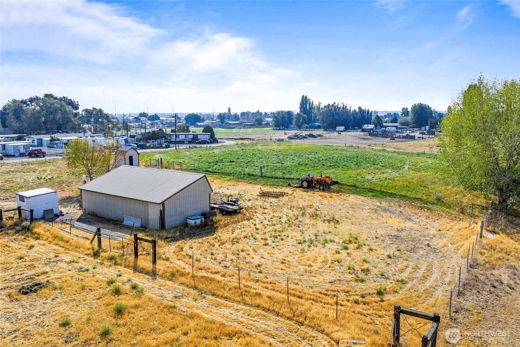 9749 Harris Road Northeast Moses Lake, WA 98837 - Photo 4 of 25 a view of a lake with a yard and furniture