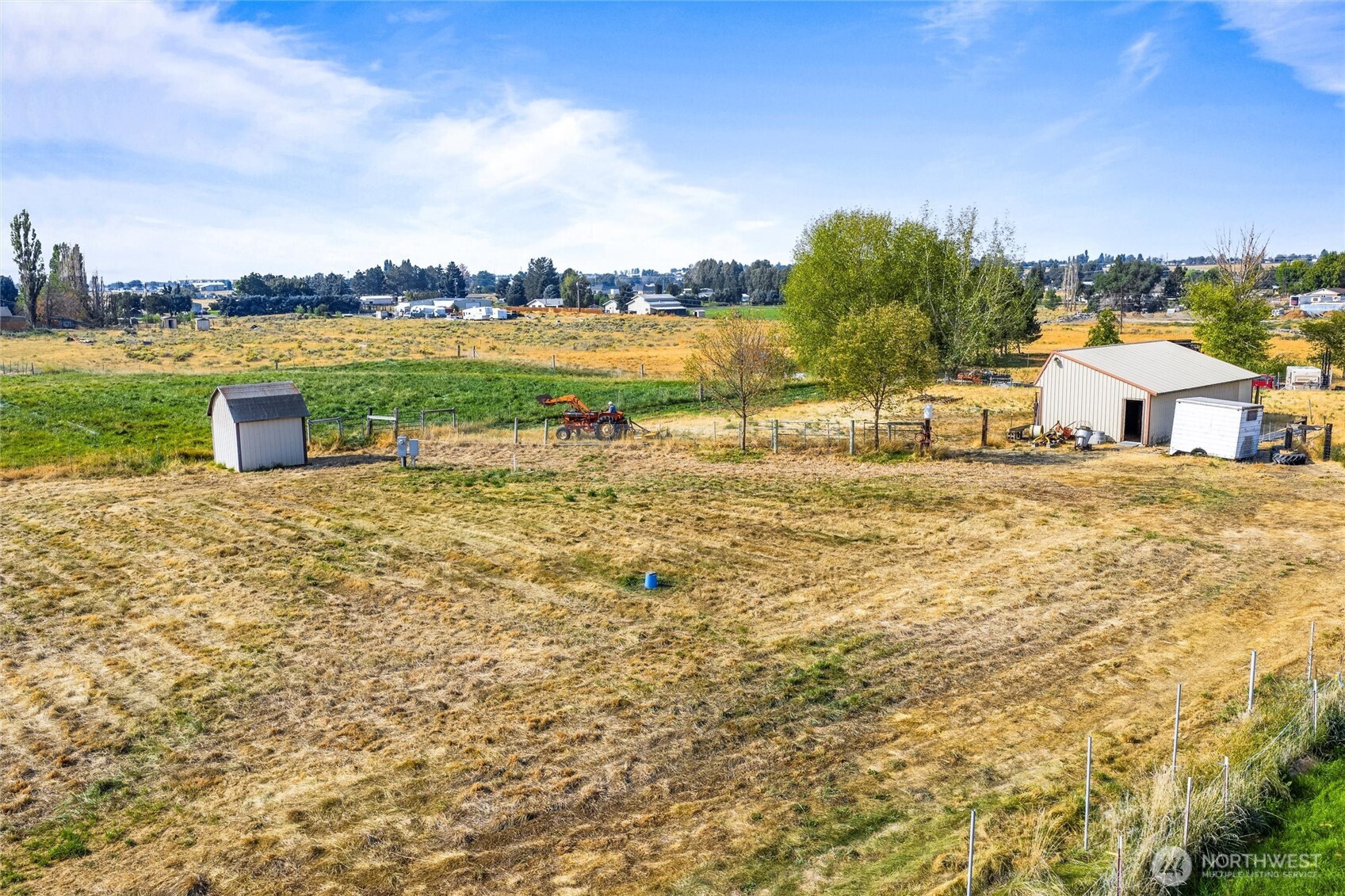 9749 Harris Road Northeast Moses Lake, WA 98837 - Photo 5 of 25 a view of a lake with houses in the back