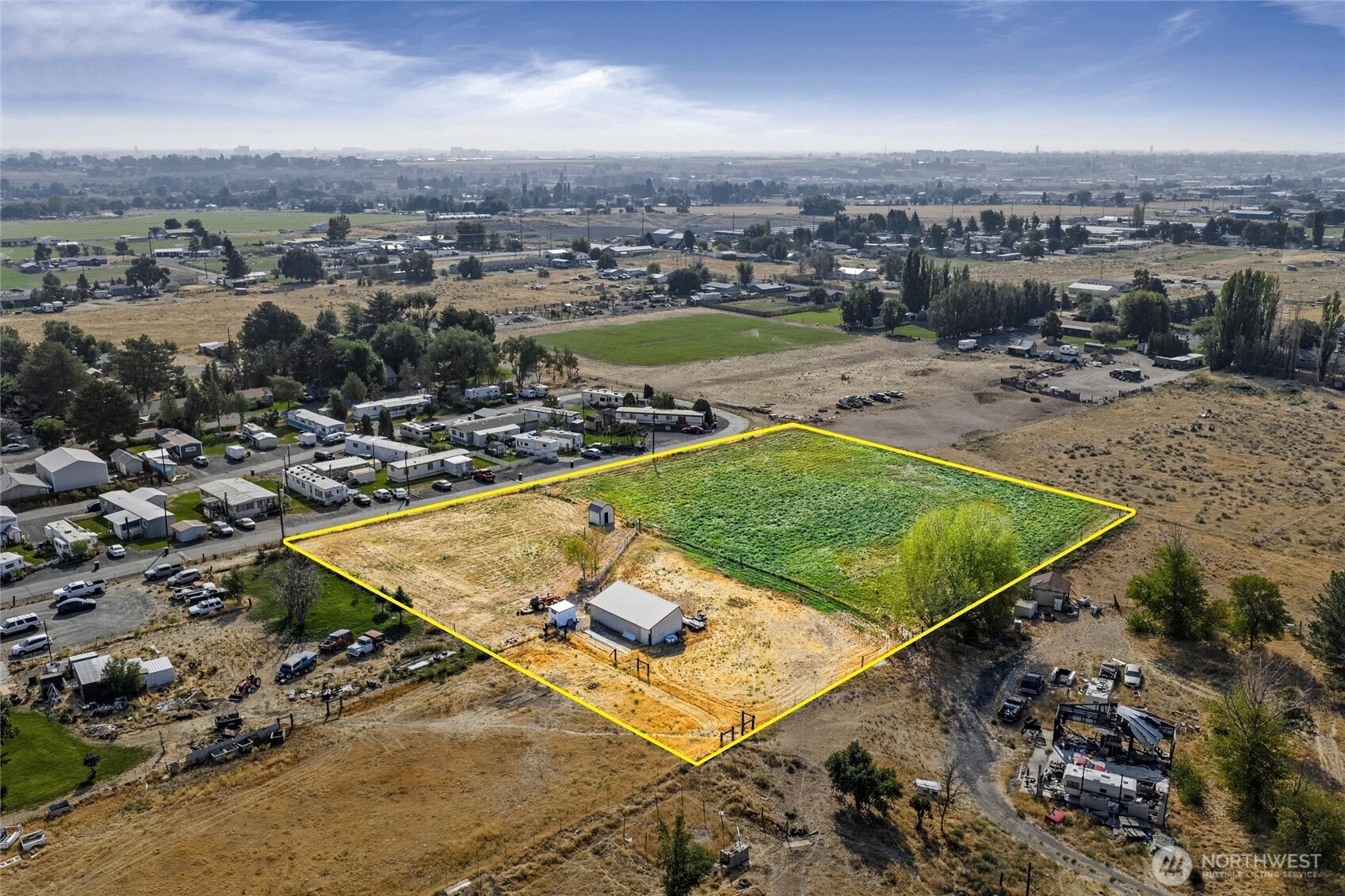 9749 Harris Road Northeast Moses Lake, WA 98837 - Photo 9 of 25 an aerial view of a backyard