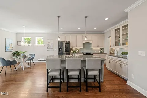 a kitchen with counter space and dining table