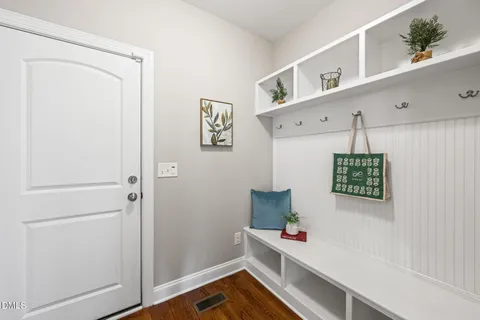 a bathroom with a granite countertop sink toilet a large mirror a shower and a bathtub