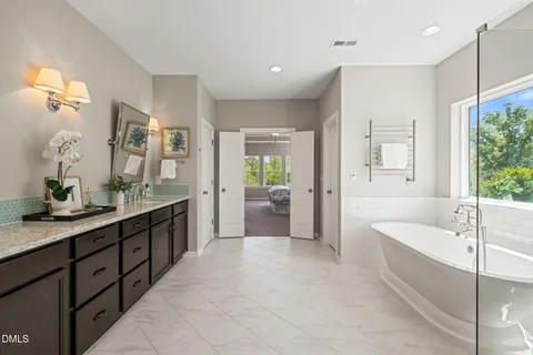 a bathroom with a bathtub and shower