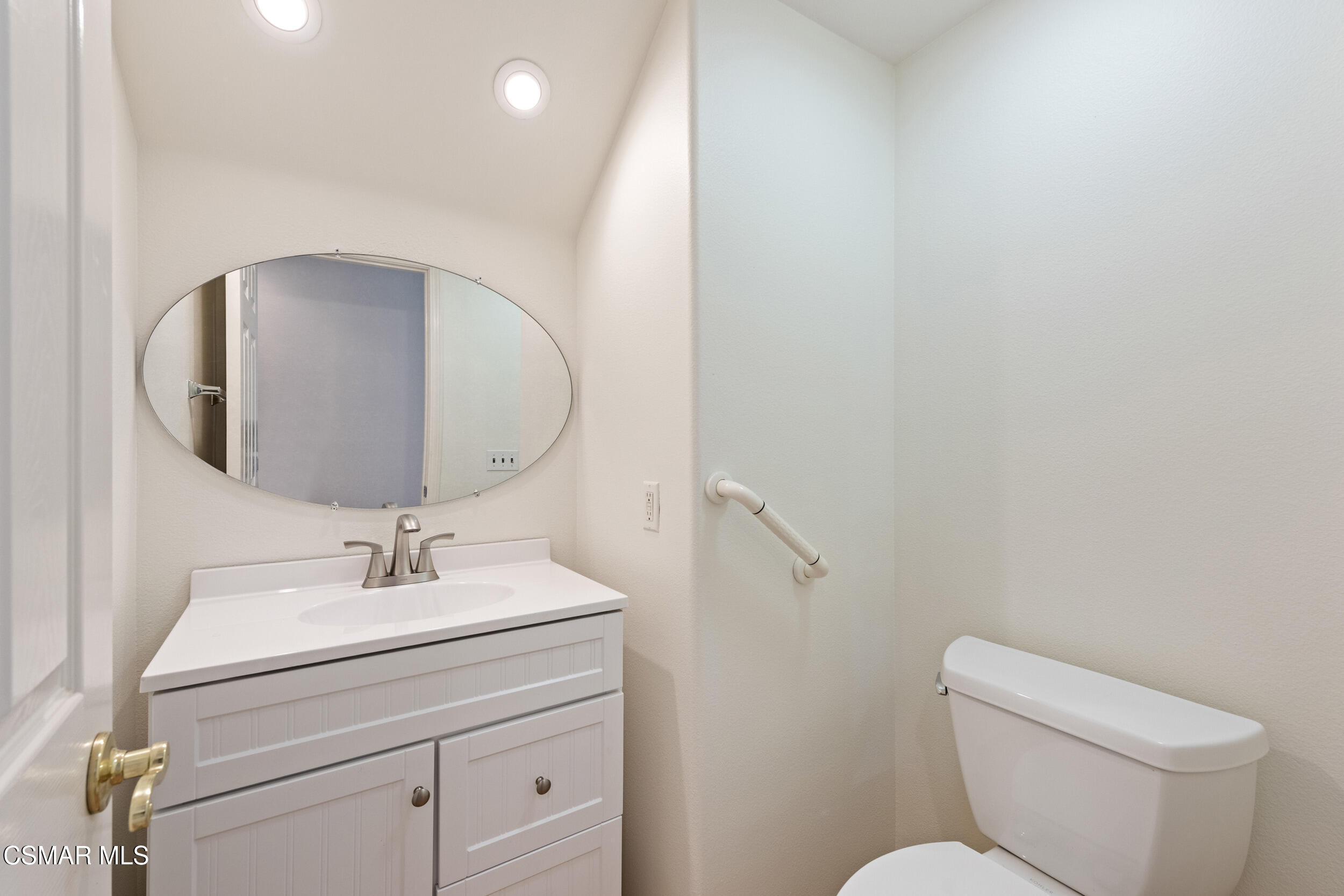 2059 Tulip Avenue Simi Valley, CA 93063 - Photo 17 of 37 a bathroom with a toilet sink and mirror