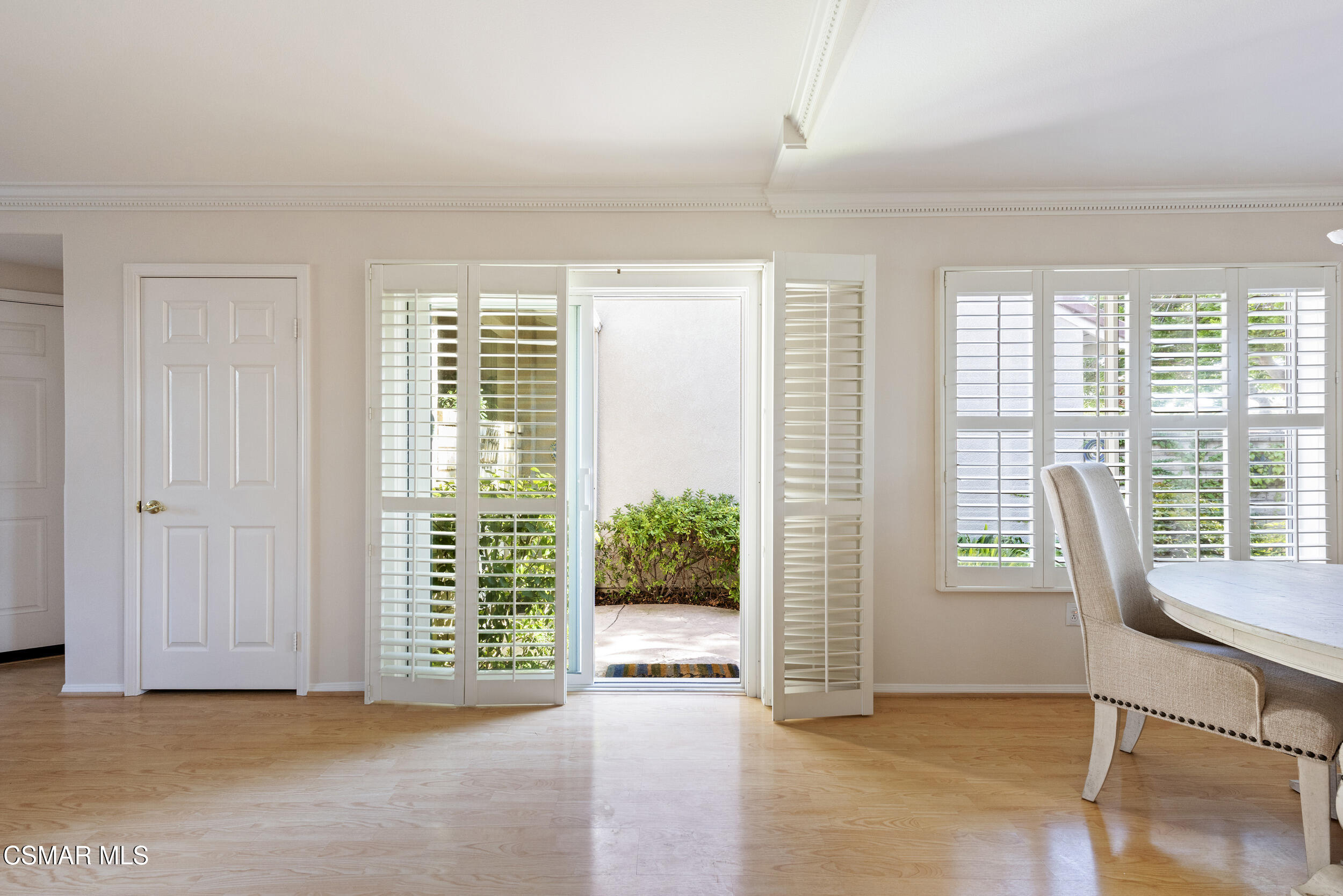 2059 Tulip Avenue Simi Valley, CA 93063 - Photo 22 of 37 a view of an empty room with wooden floor and windows