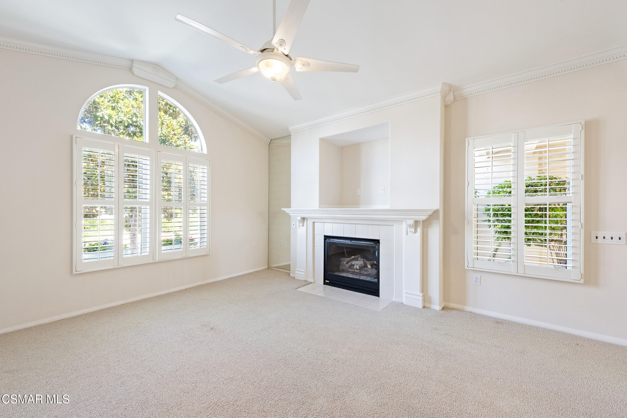2059 Tulip Avenue Simi Valley, CA 93063 - Photo 5 of 37 an empty room with windows fireplace and fan