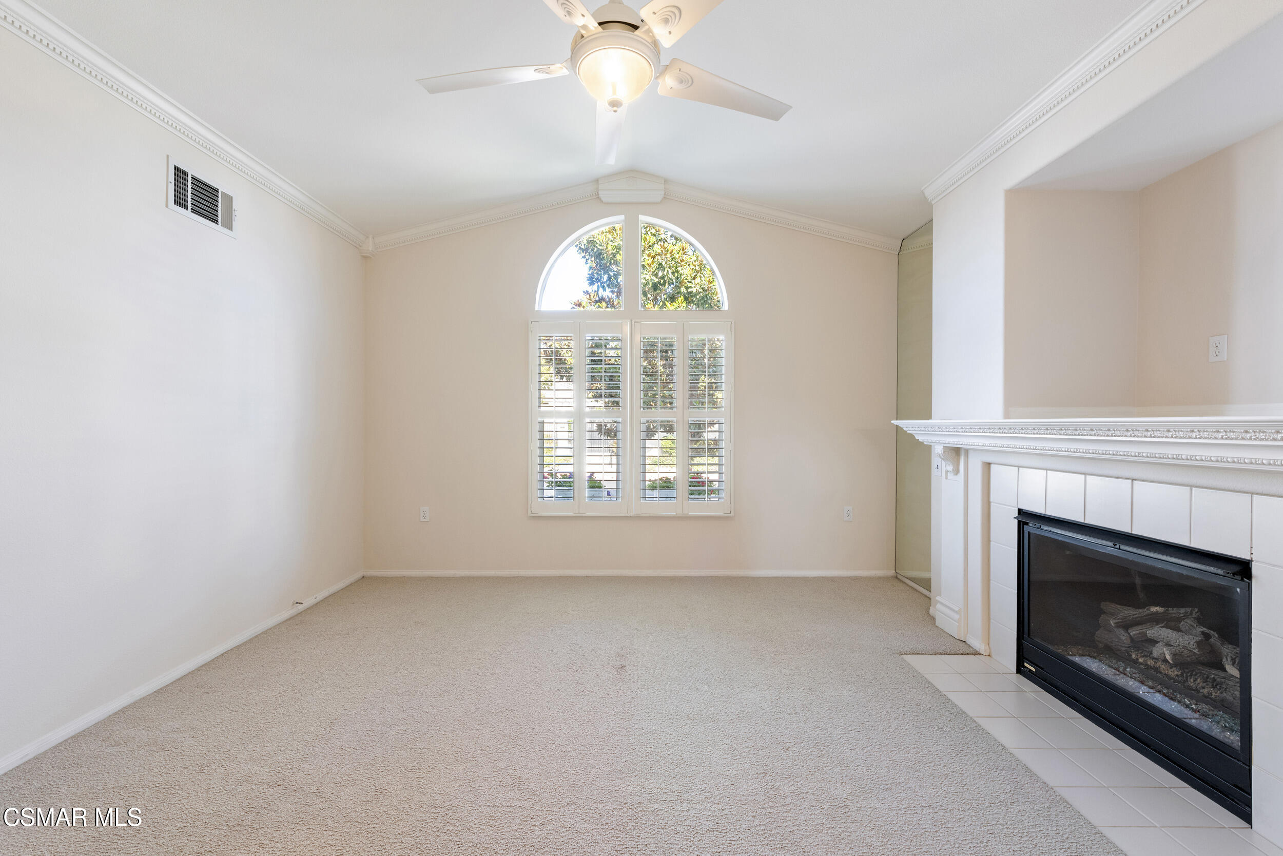 2059 Tulip Avenue Simi Valley, CA 93063 - Photo 6 of 37 an empty room with windows fireplace and fan