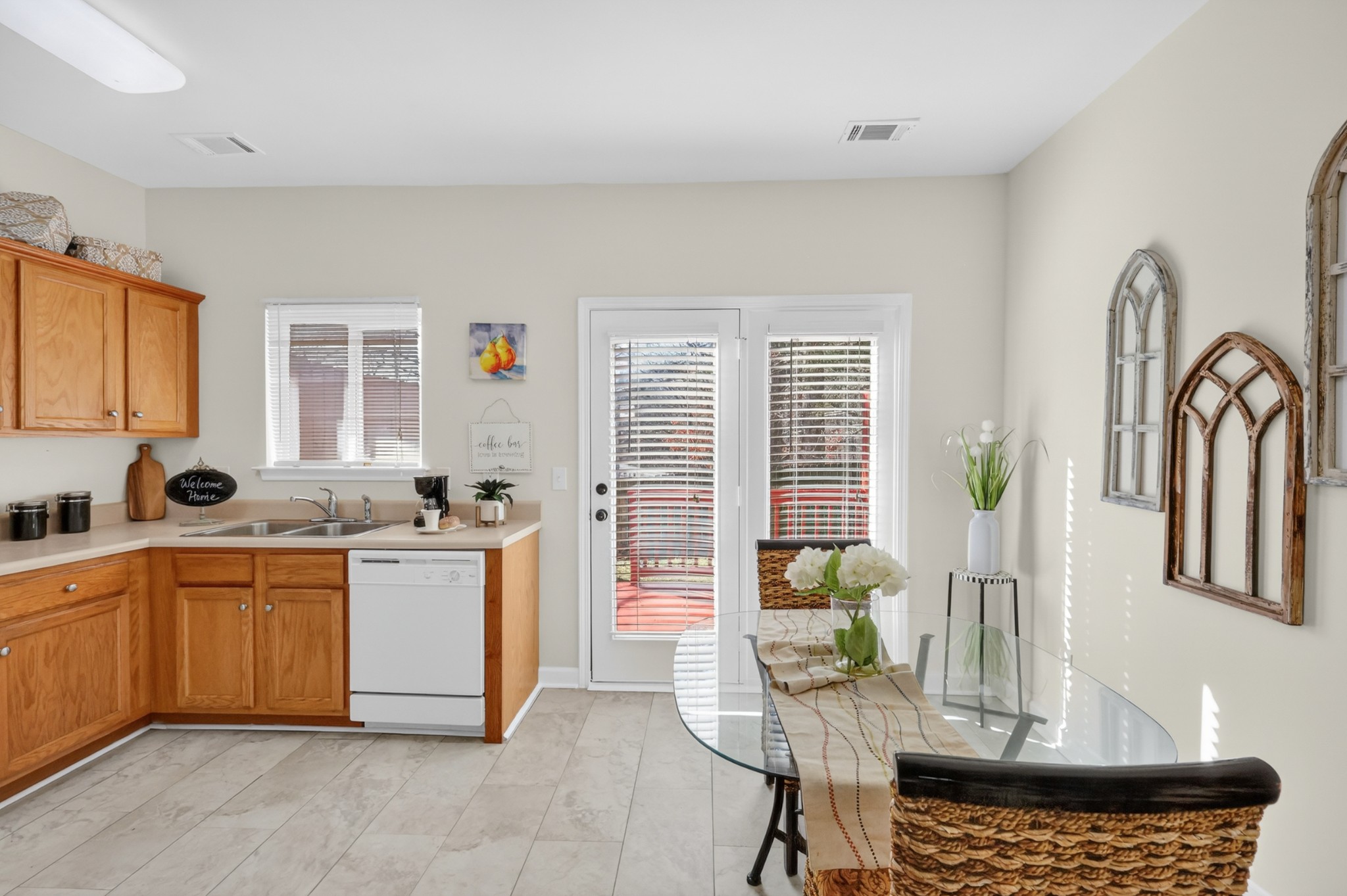 3535 Bell Road, Unit 103 Nashville, TN 37214 - Photo 12 of 29 a kitchen with stainless steel appliances granite countertop a stove a sink dishwasher a dining table and chair with wooden floor
