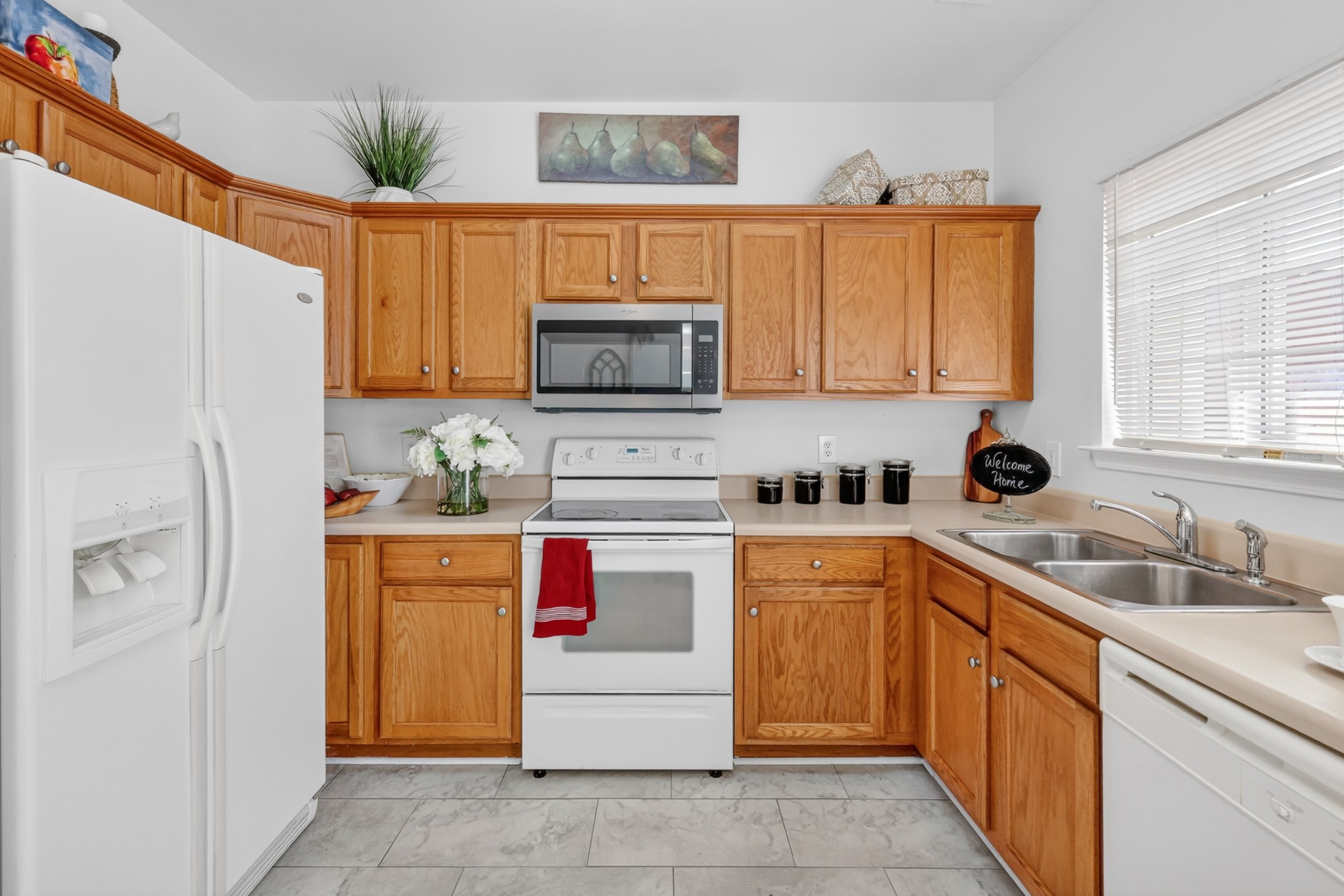 3535 Bell Road, Unit 103 Nashville, TN 37214 - Photo 13 of 29 a kitchen with stainless steel appliances granite countertop a refrigerator sink and microwave