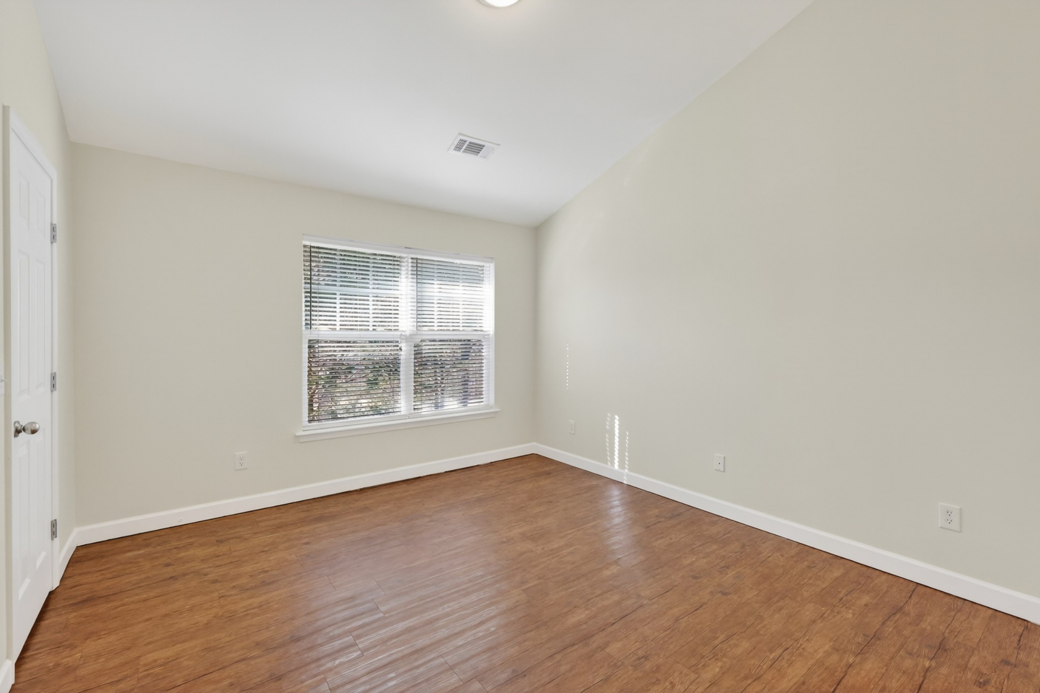 3535 Bell Road, Unit 103 Nashville, TN 37214 - Photo 14 of 29 an empty room with wooden floor and windows