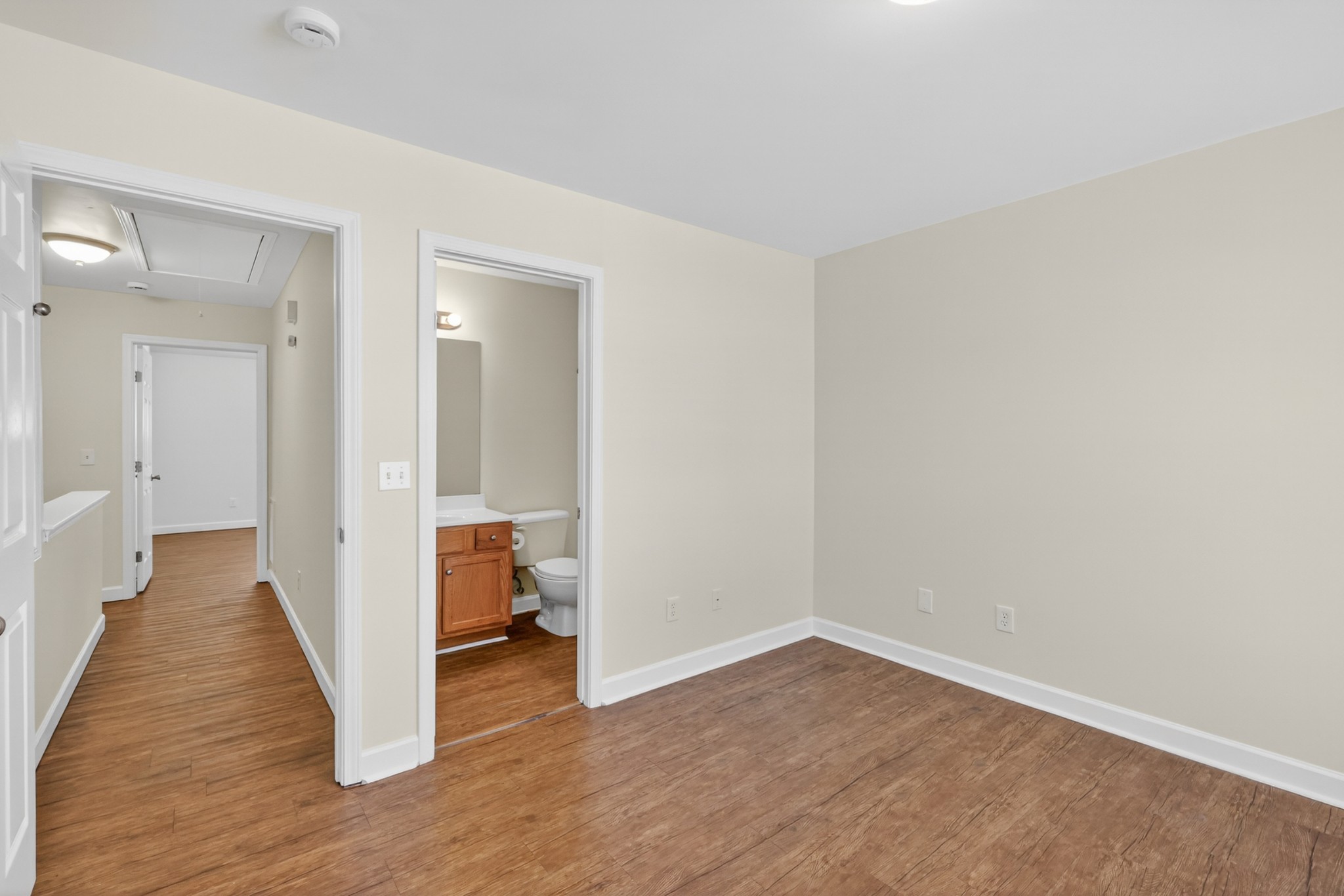 3535 Bell Road, Unit 103 Nashville, TN 37214 - Photo 19 of 29 a view of a hallway with wooden floor and a bathroom