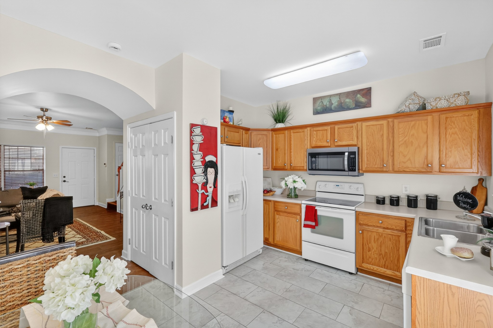 3535 Bell Road, Unit 103 Nashville, TN 37214 - Photo 10 of 29 a kitchen with stainless steel appliances a stove a sink and a refrigerator