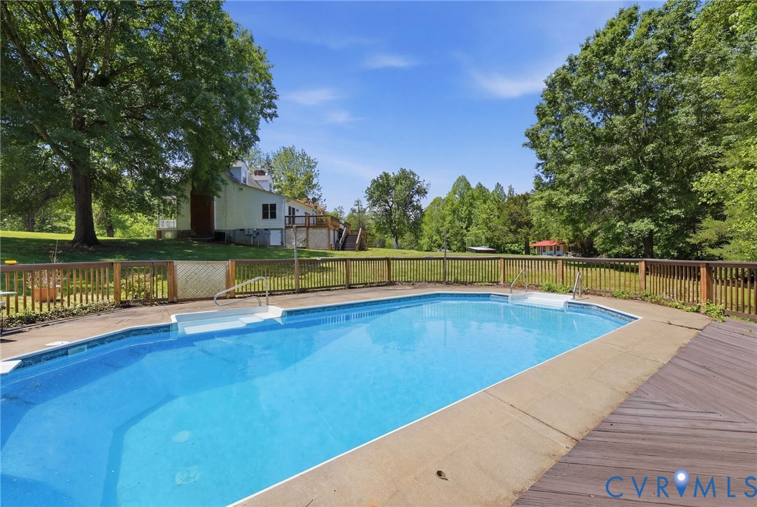 3355 Duke Road Powhatan, VA 23139 - Photo 7 of 67 a view of a swimming pool with an outdoor seating and a yard
