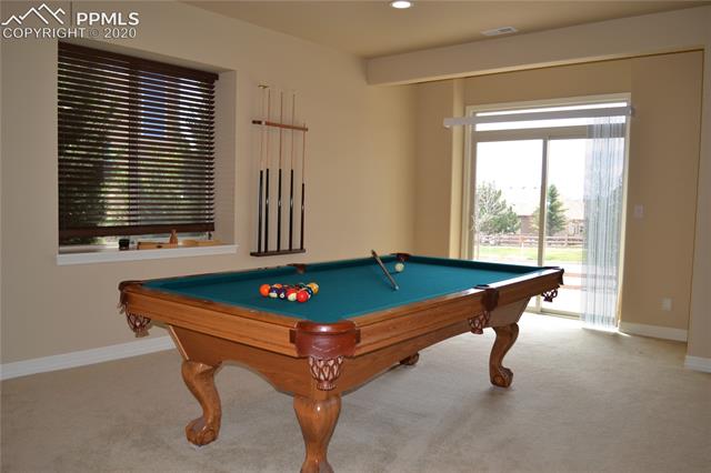 2353 Cinnabar Road Colorado Springs, CO 80921 - Photo 40 of 48 Basement family room/rec room with walkout to rear of house