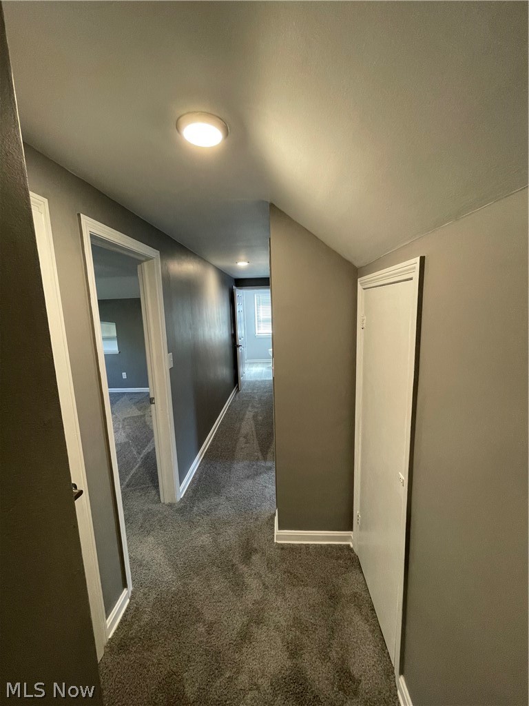 14516 Rockside Road Maple Heights, OH 44137 - Photo 18 of 30 Hall with dark colored carpet and vaulted ceiling