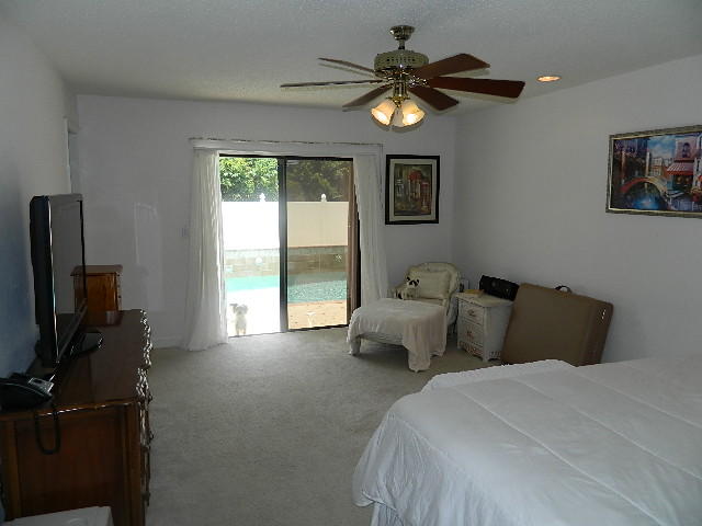 4604 Brandywine Drive Boca Raton, FL 33487 - Photo 16 of 25 MASTER BEDROOM OVERLOOKING POOL