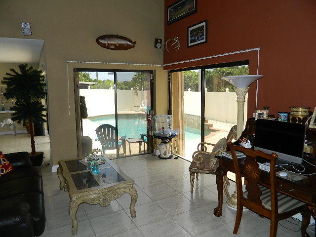 4604 Brandywine Drive Boca Raton, FL 33487 - Photo 21 of 25 FAMILY ROOM OVERLOOKING POOL