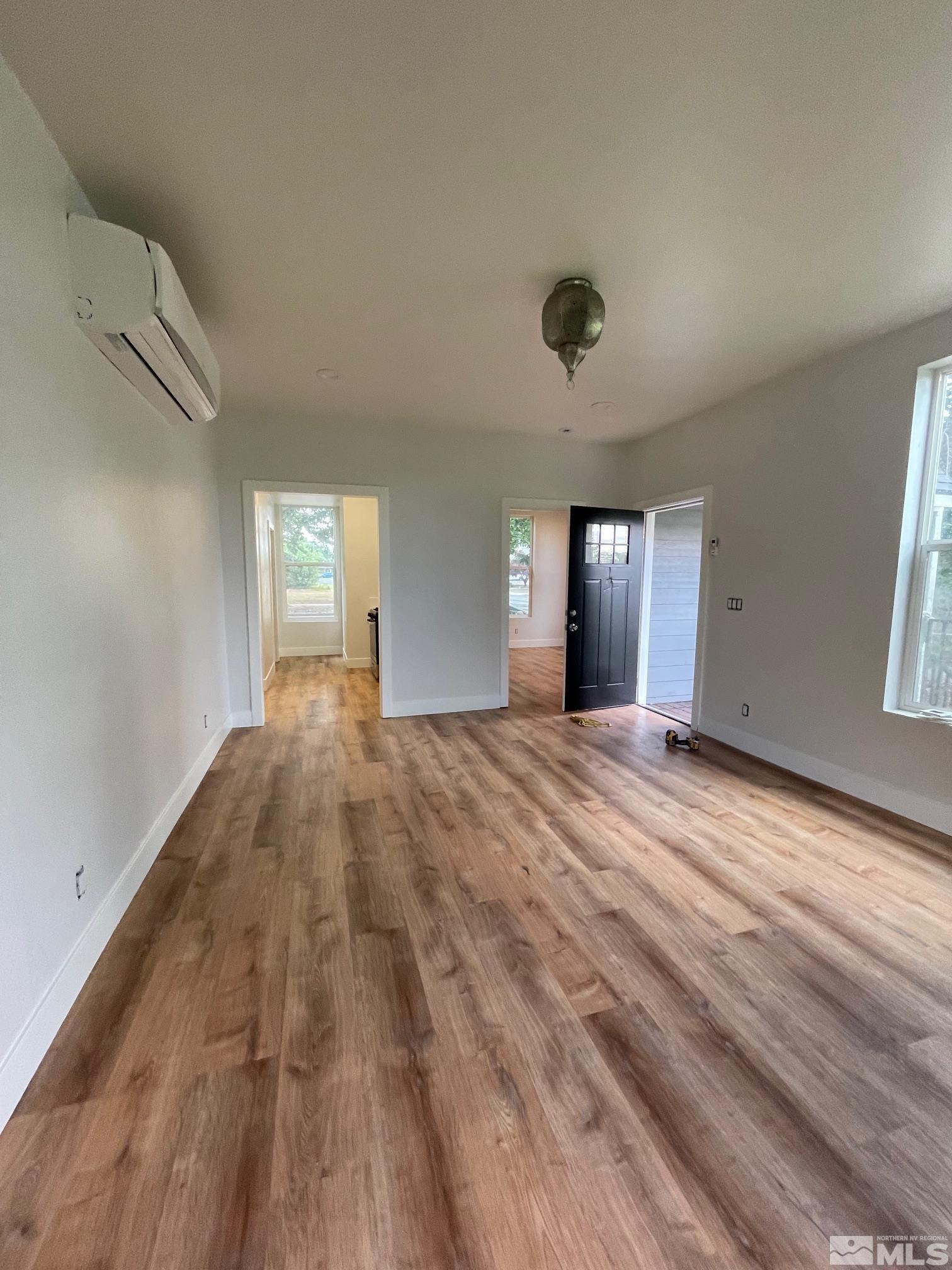606 East 7th Street Reno, NV 89512 - Photo 17 of 35 a view of empty room with wooden floor and fan