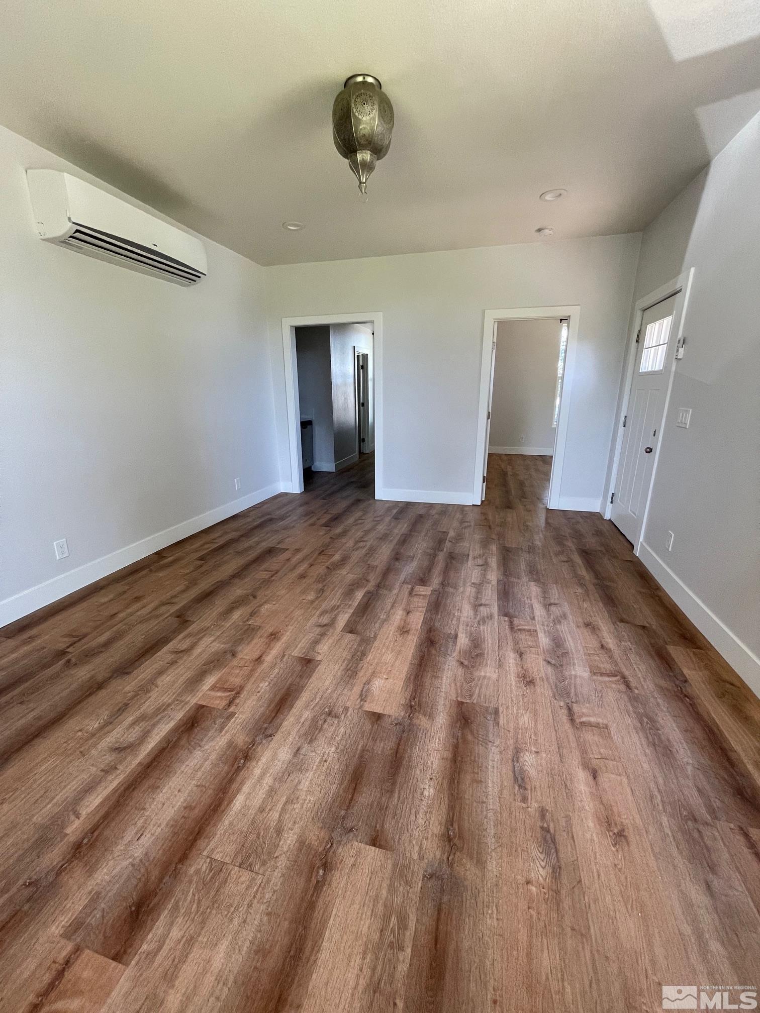 606 East 7th Street Reno, NV 89512 - Photo 18 of 35 a view of an empty room and wooden floor