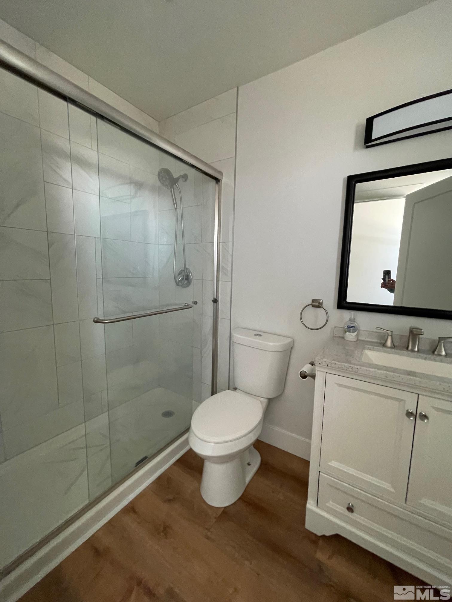 606 East 7th Street Reno, NV 89512 - Photo 21 of 35 a bathroom with a toilet sink and a shower