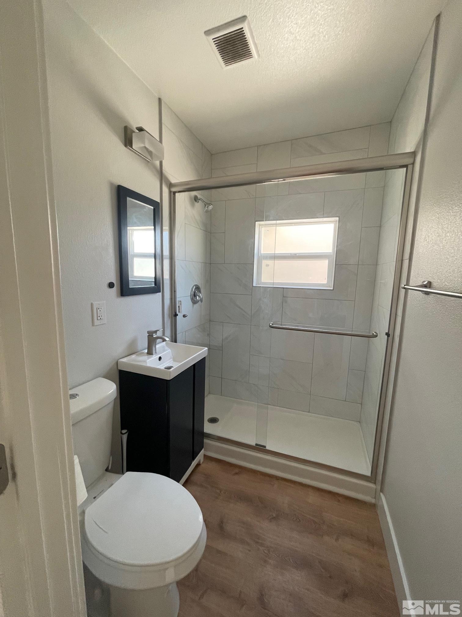 606 East 7th Street Reno, NV 89512 - Photo 34 of 35 a bathroom with a sink toilet and shower