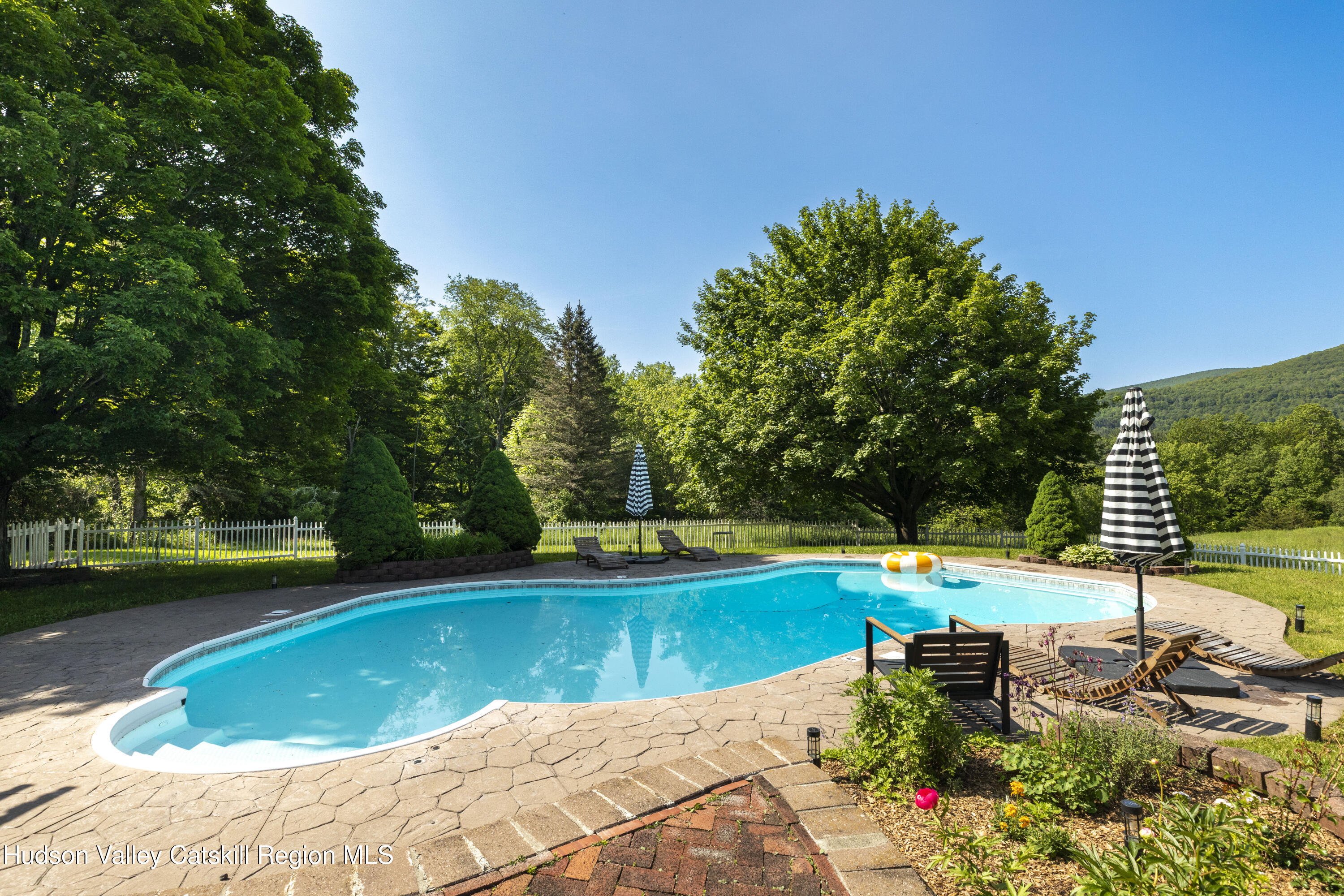 89 Cartwright Road Prattsville, NY 12468 - Photo 31 of 44 a view of a swimming pool and lounge chair