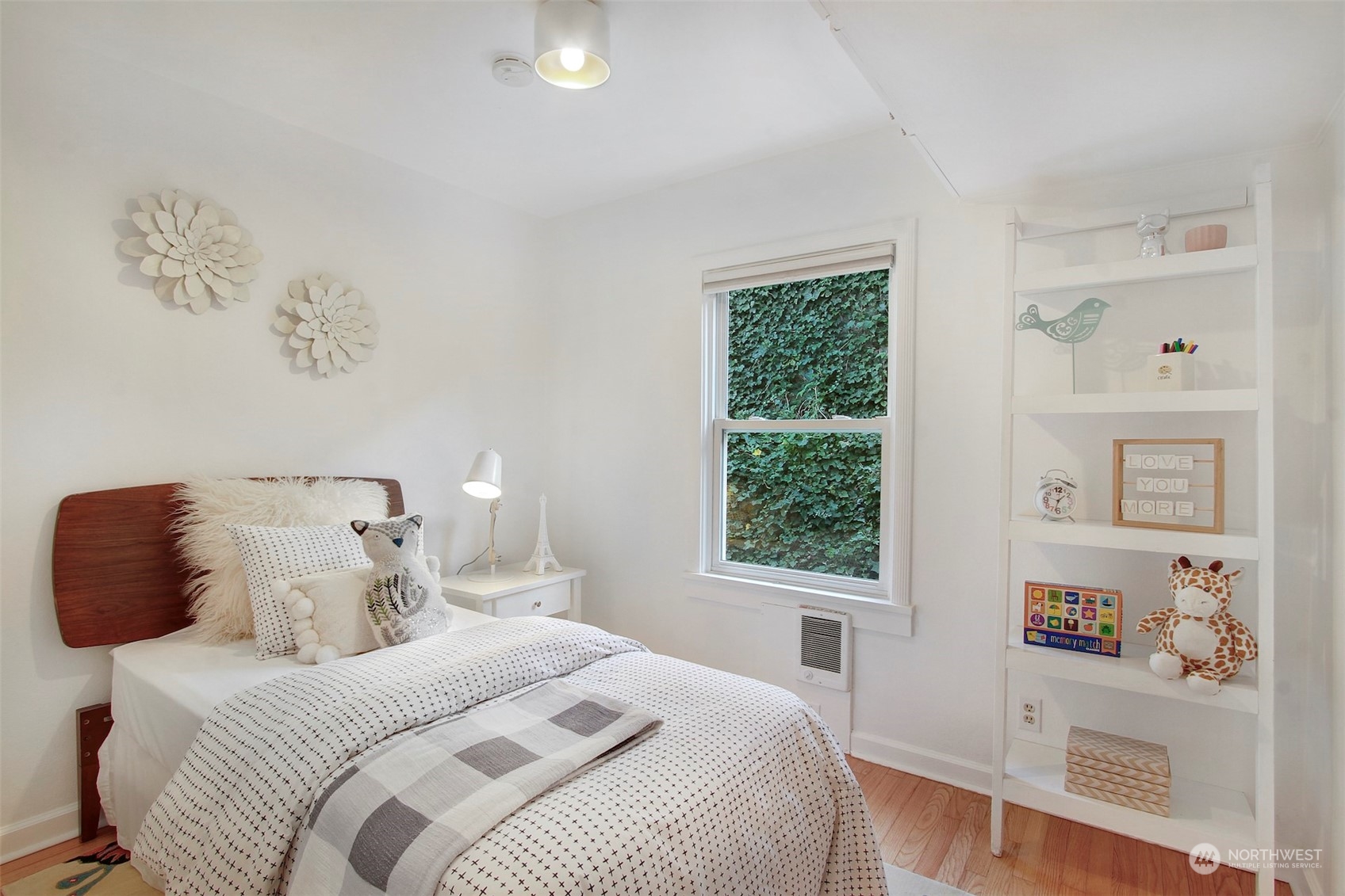 906 North 88th Street Seattle, WA 98103 - Photo 11 of 23 a bedroom with a bed and a window