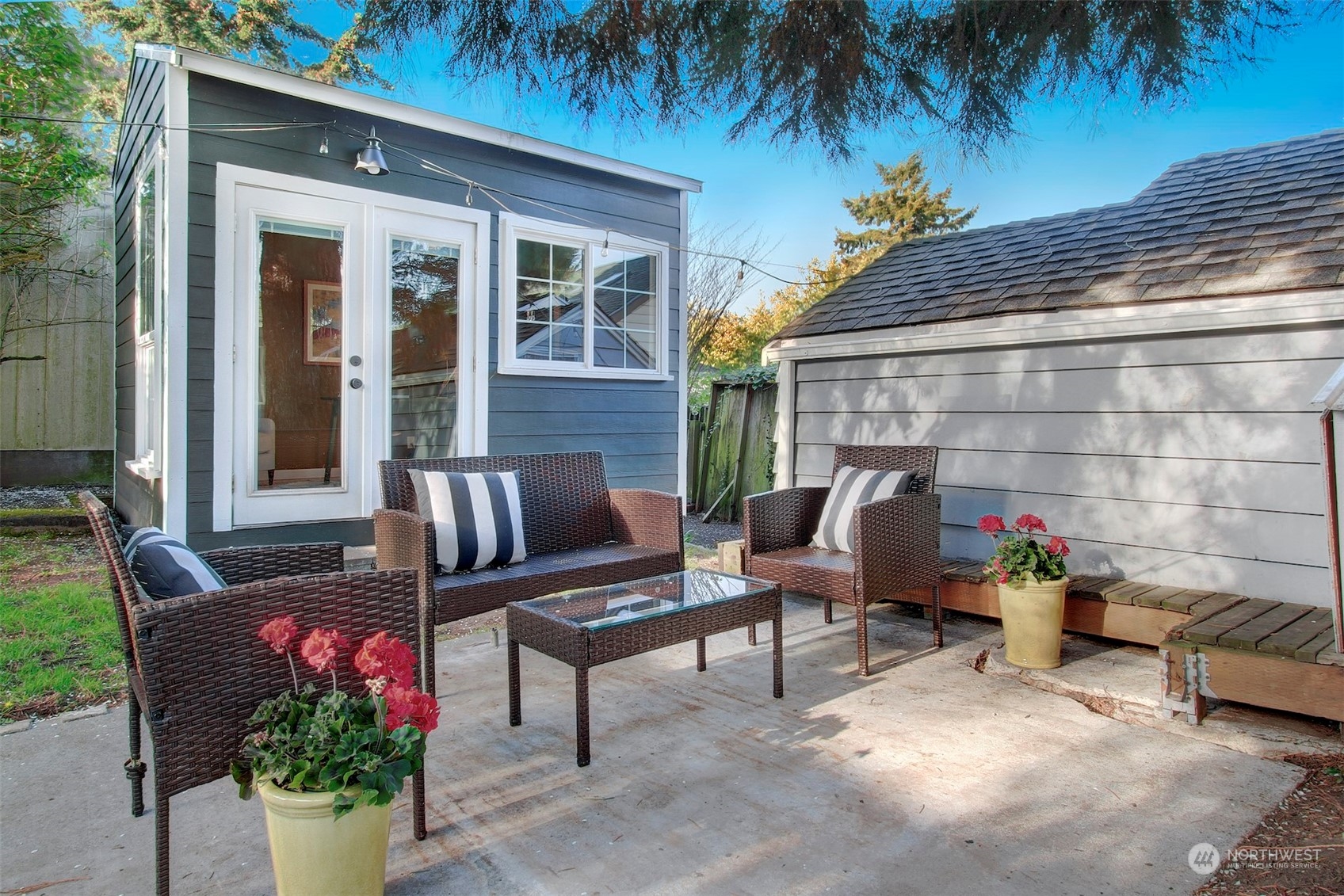 906 North 88th Street Seattle, WA 98103 - Photo 17 of 23 a outdoor living space with furniture and a potted plant