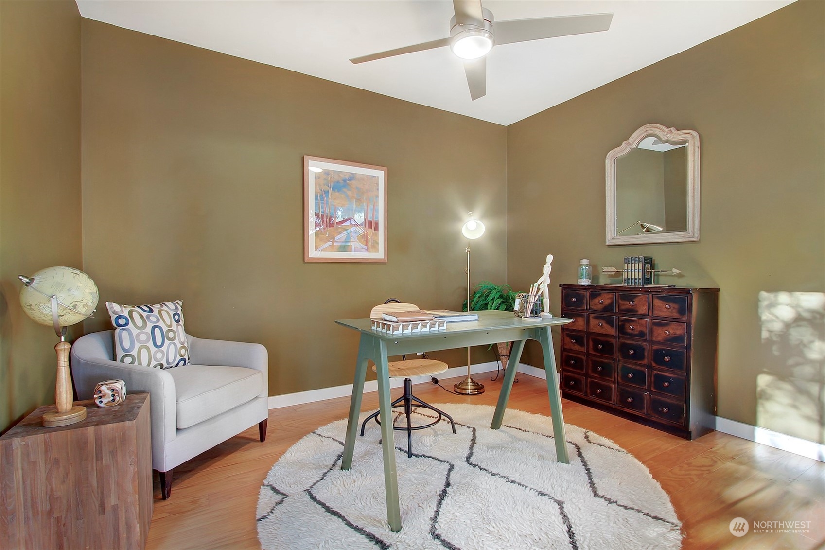 906 North 88th Street Seattle, WA 98103 - Photo 18 of 23 a bed room with furniture and a ceiling fan