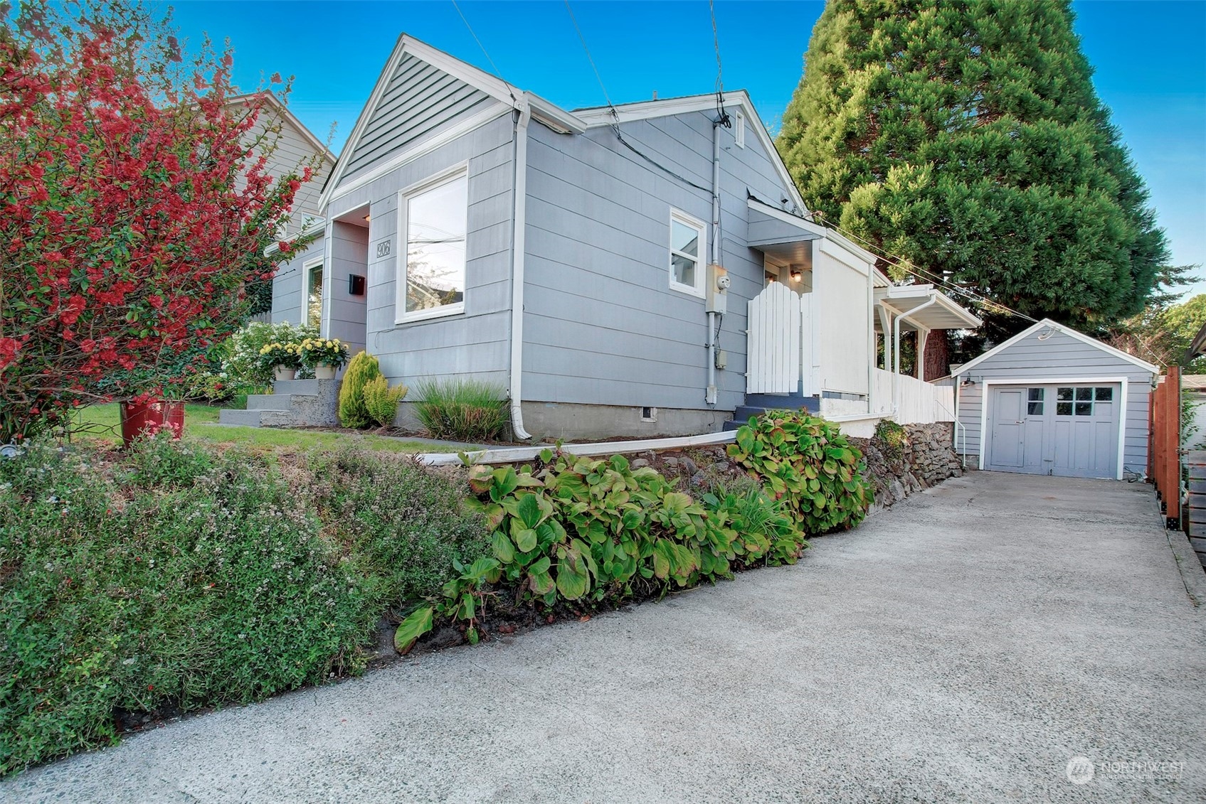 906 North 88th Street Seattle, WA 98103 - Photo 22 of 23 a view of a house with a yard and potted plants