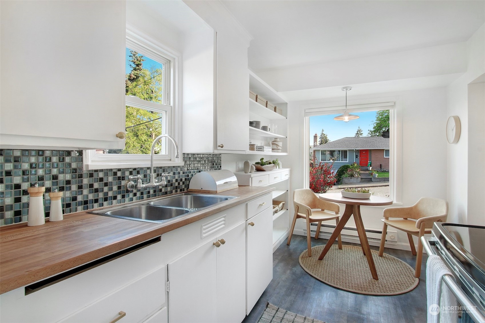 906 North 88th Street Seattle, WA 98103 - Photo 5 of 23 a kitchen with a sink and a stove top oven