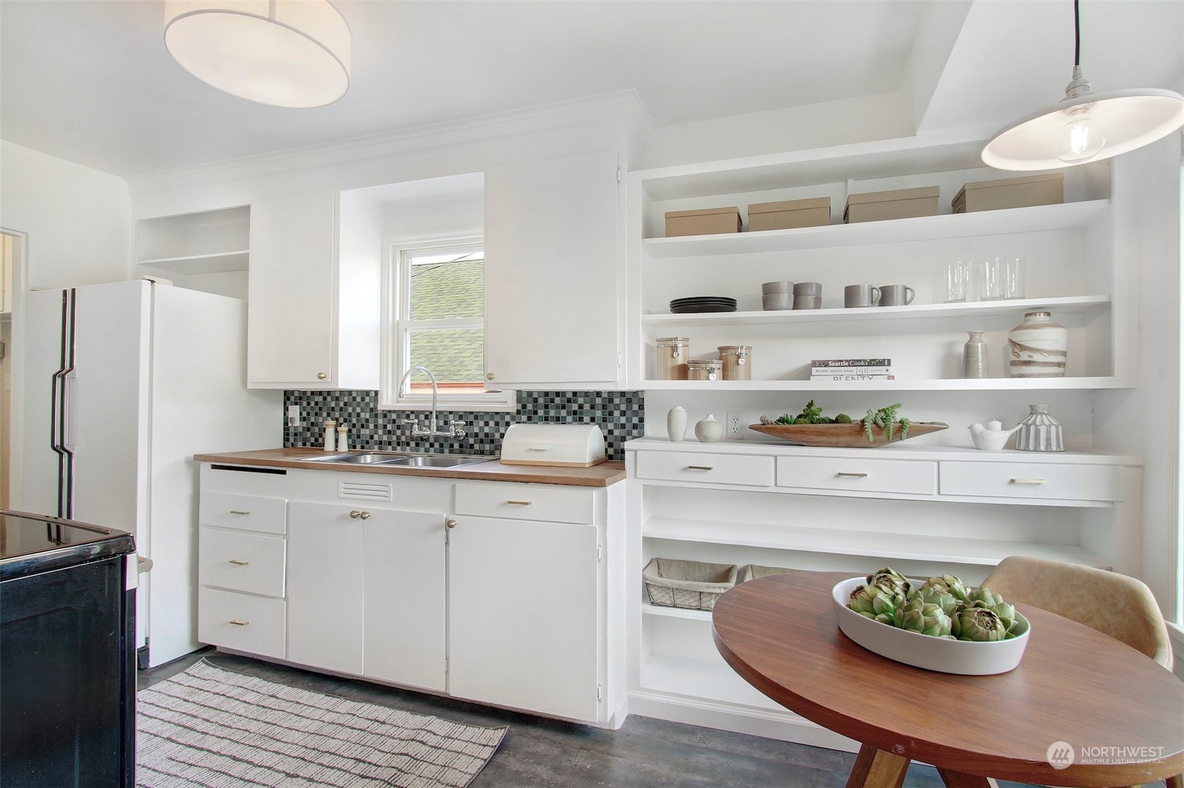 906 North 88th Street Seattle, WA 98103 - Photo 6 of 23 a kitchen with a white cabinets and appliances