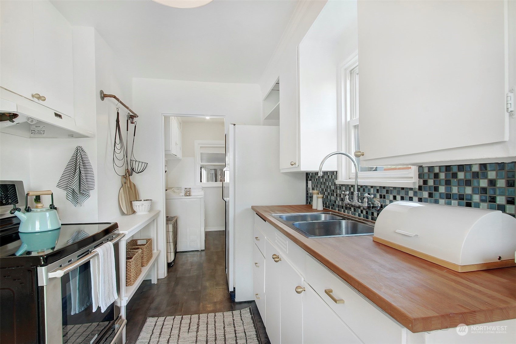 906 North 88th Street Seattle, WA 98103 - Photo 7 of 23 a spacious bathroom with a double vanity sink a mirror and a shower