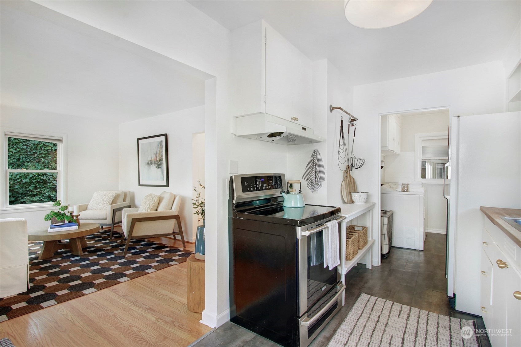 906 North 88th Street Seattle, WA 98103 - Photo 8 of 23 a kitchen with stainless steel appliances granite countertop a stove and a refrigerator