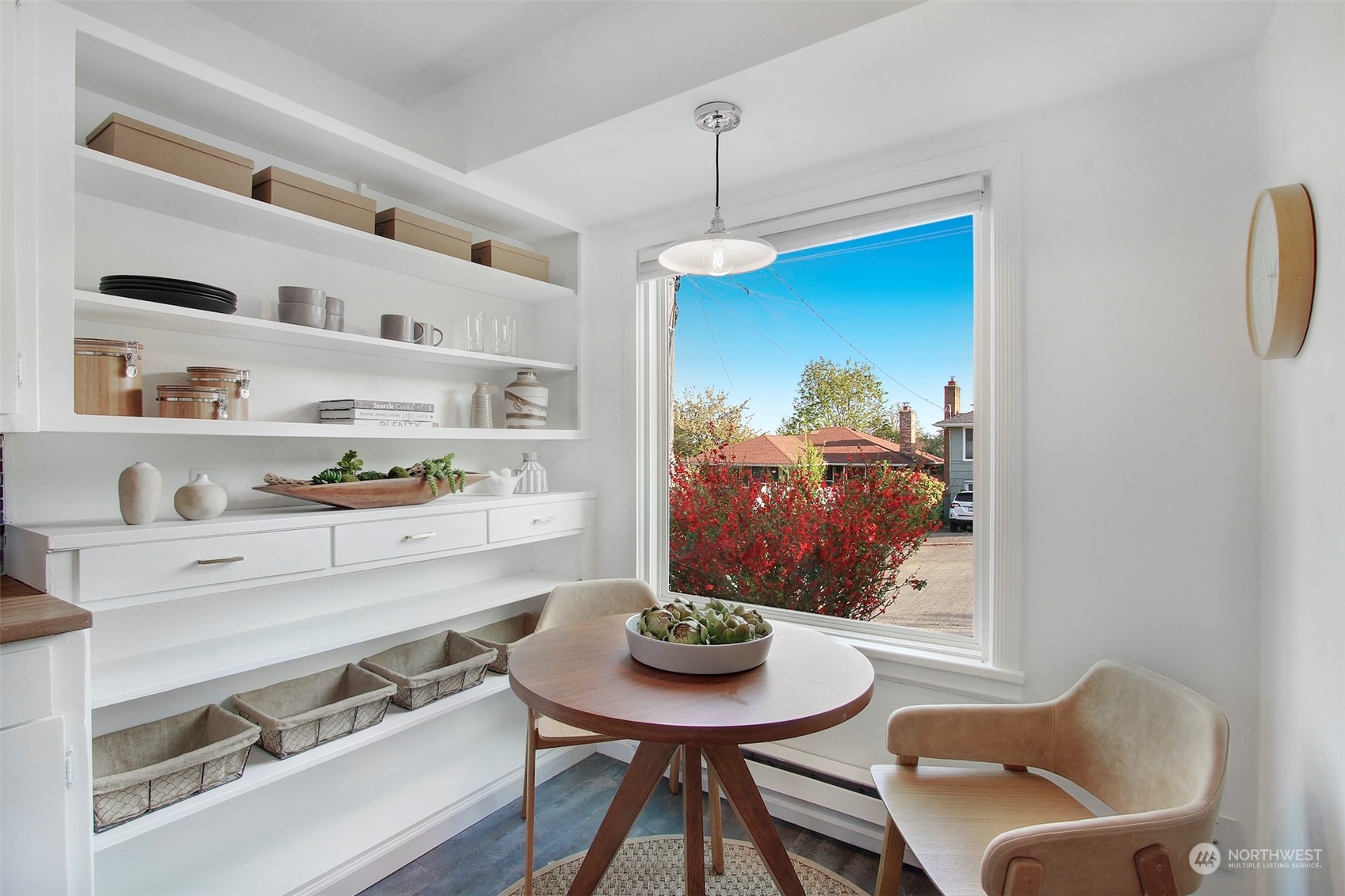 906 North 88th Street Seattle, WA 98103 - Photo 9 of 23 a view of a dining room with furniture a rug and wooden floor