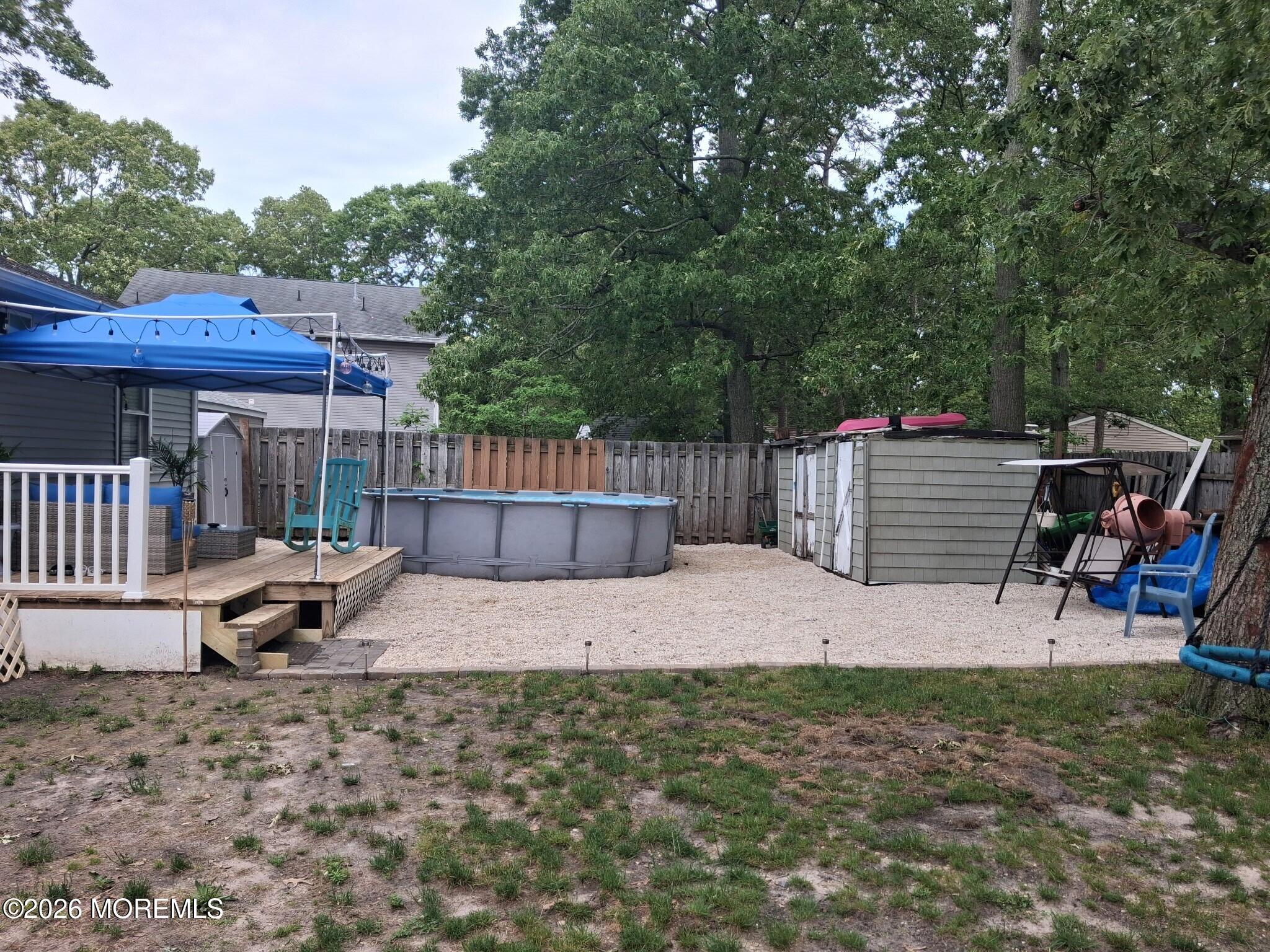 612 Nantucket Road Forked River, NJ 08731 - Photo 21 of 22 a view of a patio with a table and chairs