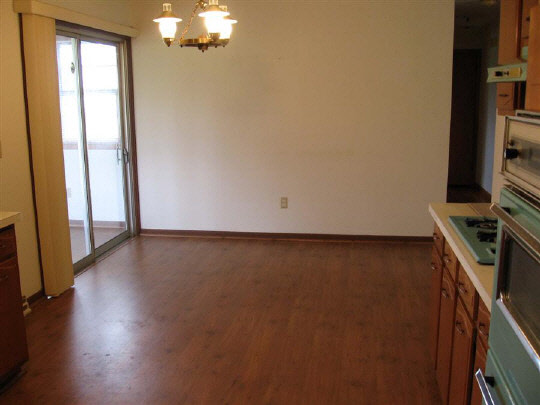 6891 Tipple Road Rockford, IL 61102 - Photo 3 of 6 wooden floor in an empty room with a window