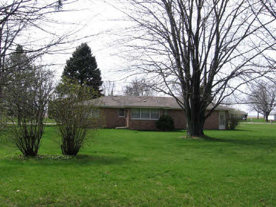 6891 Tipple Road Rockford, IL 61102 - Photo 6 of 6 a view of a backyard with large trees