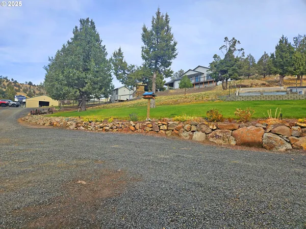 a kitchen with stainless steel appliances granite countertop a sink stove and microwave