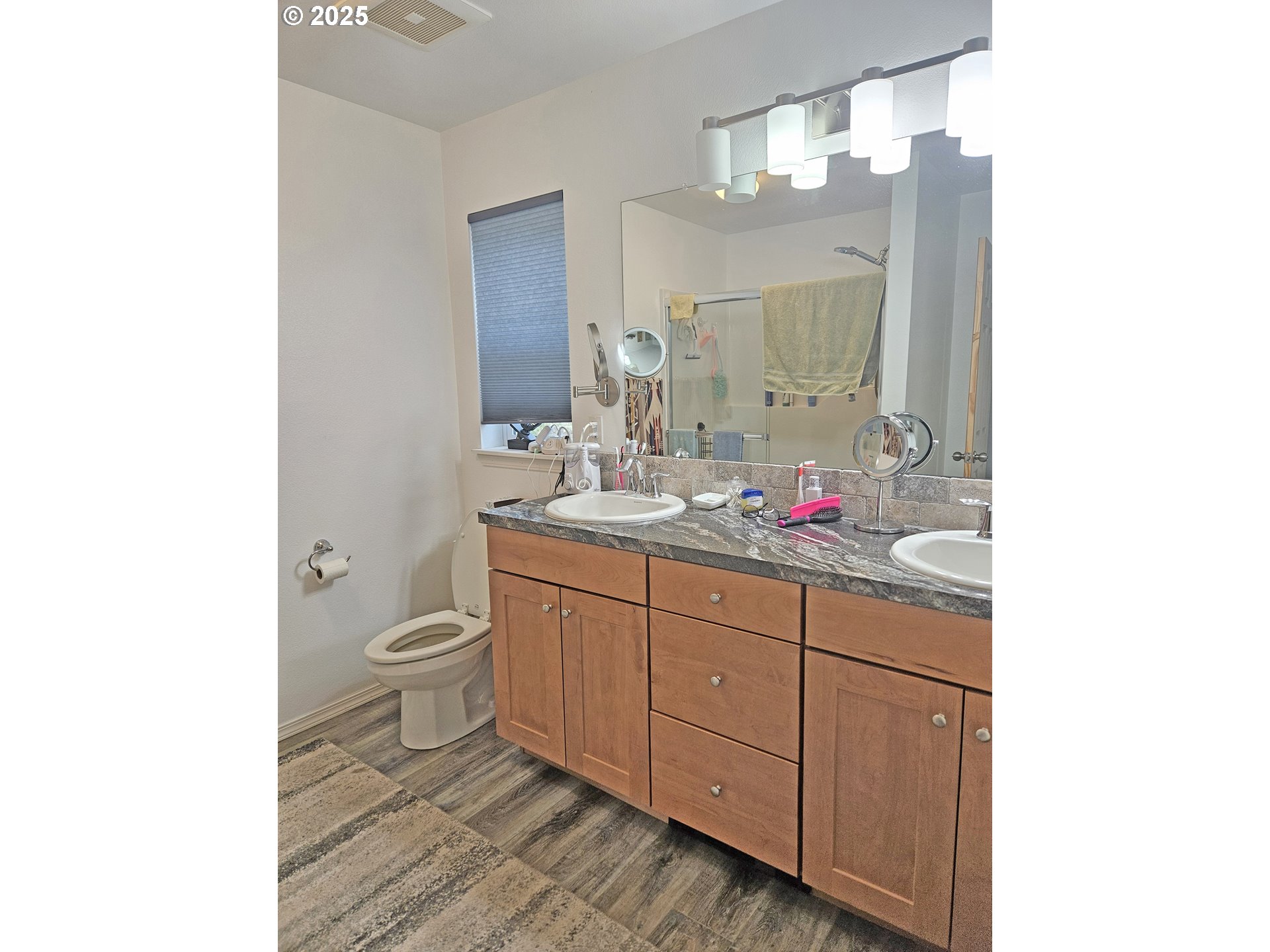 46457 Highway 218 Fossil, OR 97830 - Photo 24 of 45 a bathroom with a granite countertop sink mirror vanity and toilet