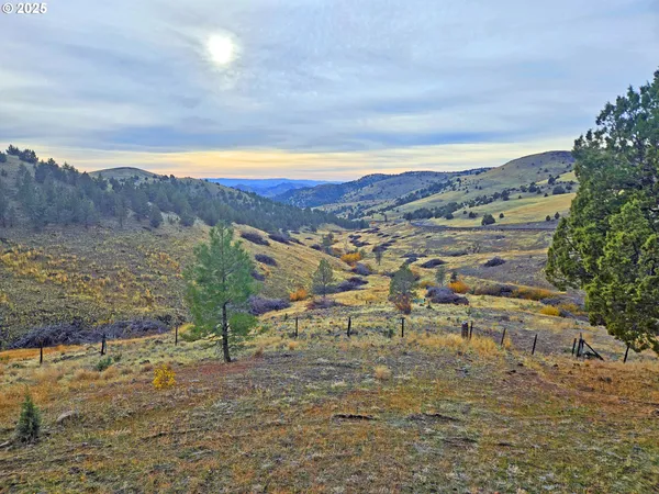a outdoor living space with furniture a fireplace and a window