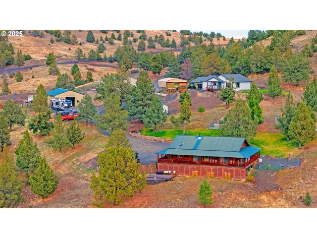 a view of a dining room with furniture and a chandelier