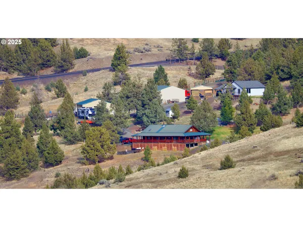 an aerial view of a house with a ocean view