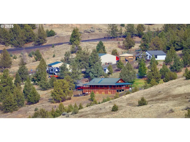 an aerial view of a house with a ocean view