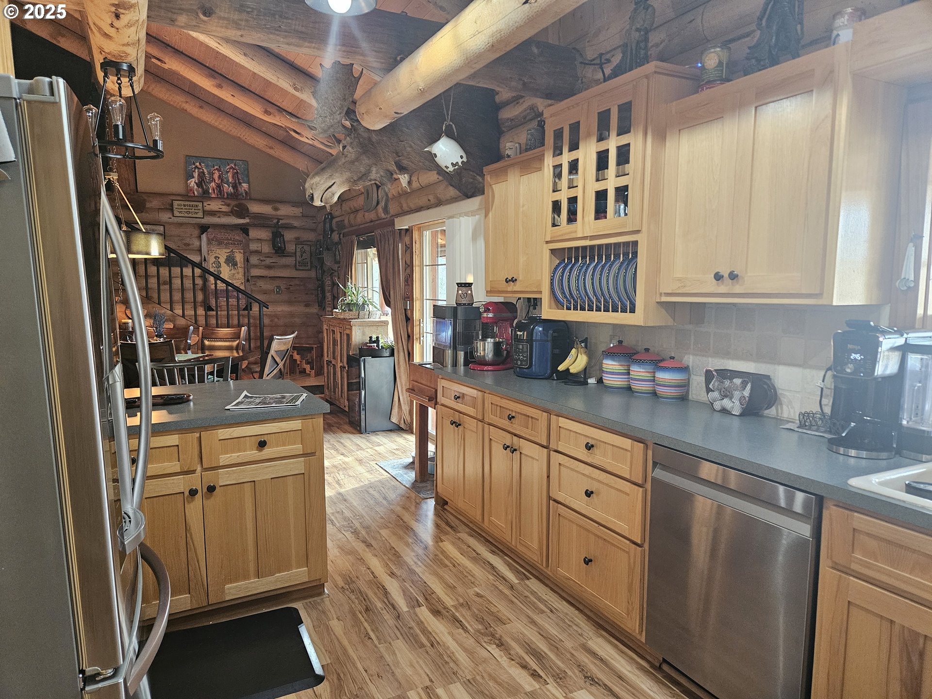 46457 Highway 218 Fossil, OR 97830 - Photo 32 of 45 a kitchen with stainless steel appliances granite countertop a stove and cabinets