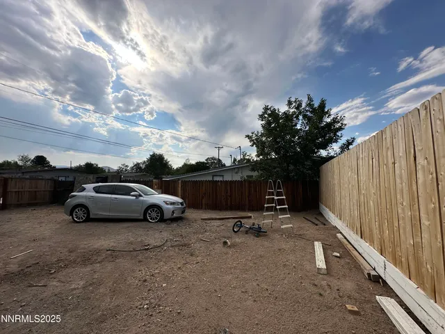a view of room with window and hallway