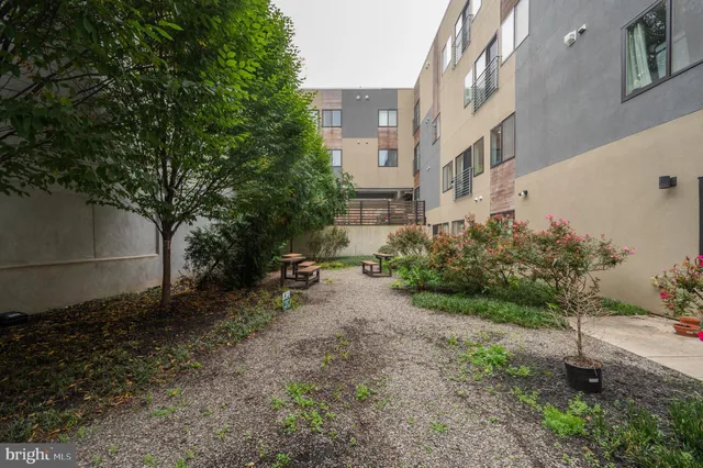 a view of a street with sitting area