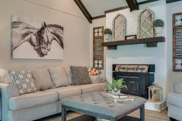 a living room with furniture and a fireplace
