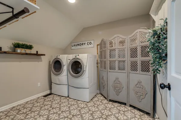 a utility room with dryer and washer