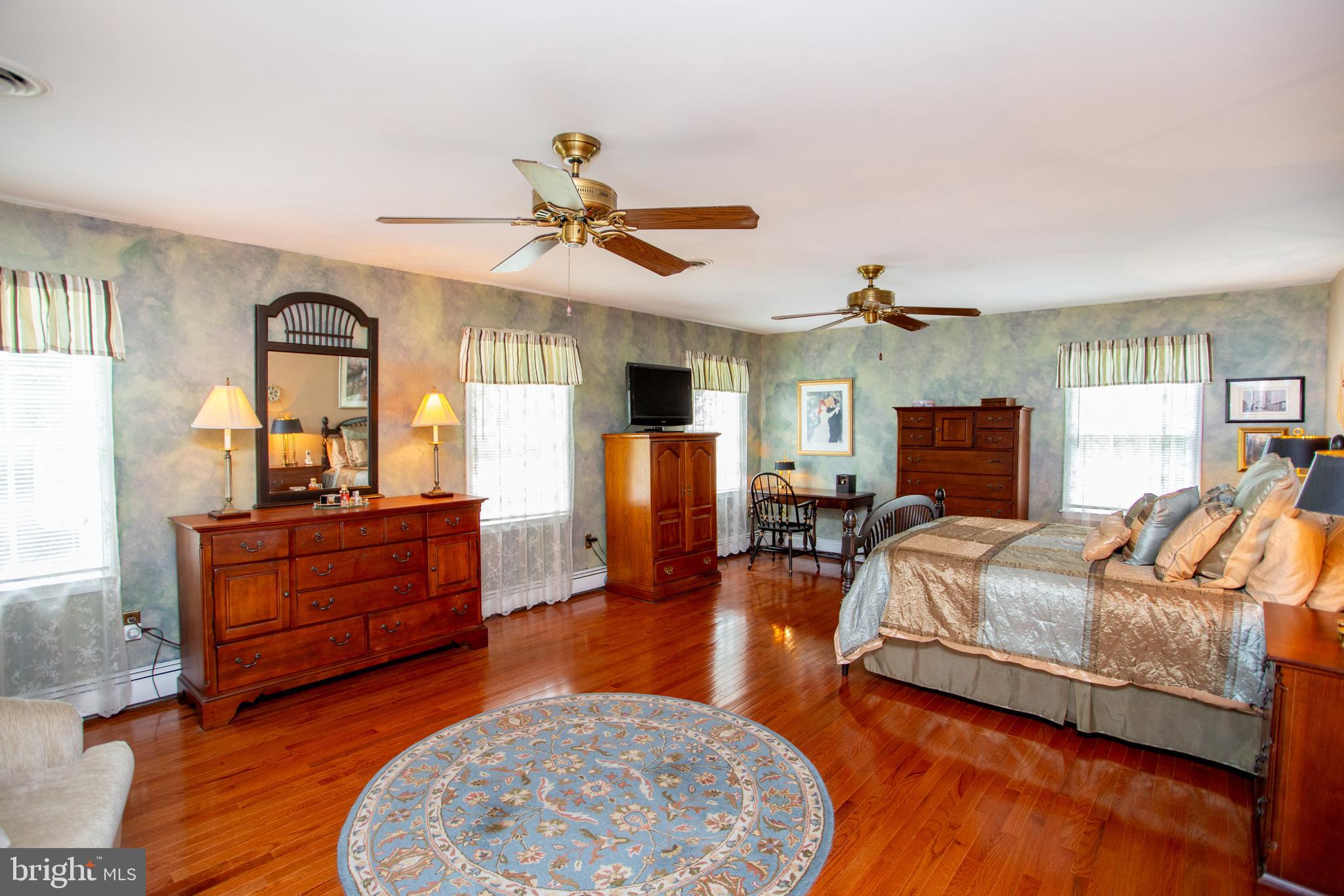 950 Camelot Road Furlong, PA 18925 - Photo 34 of 106 a living room with furniture and a flat screen tv